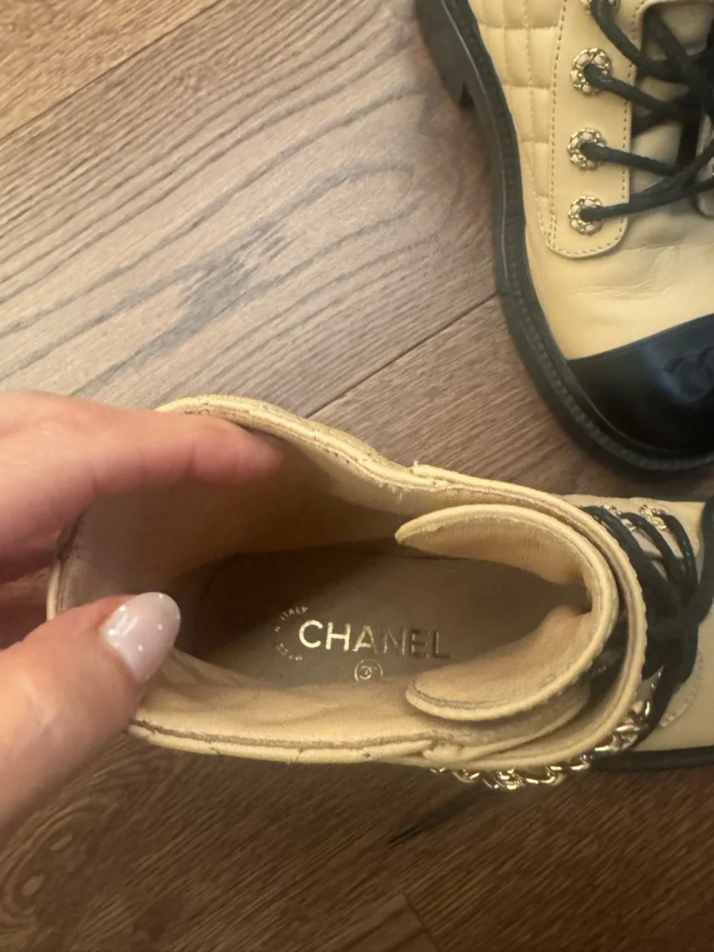 CHANEL Two-Tone Quilted Combat Boots in Beige and Black